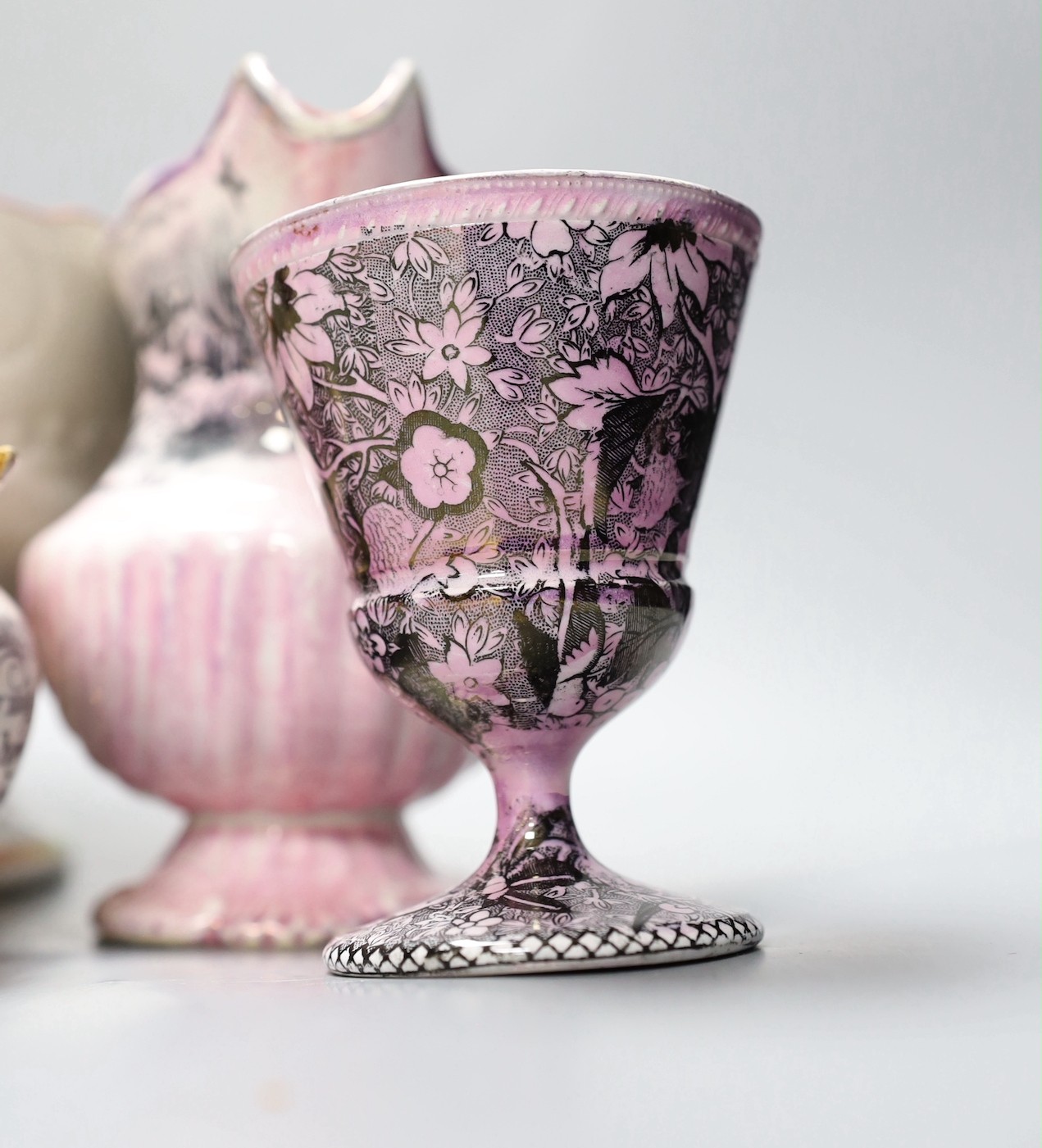 A group of early 19th century pink lustre vases and jugs and a junket bowl